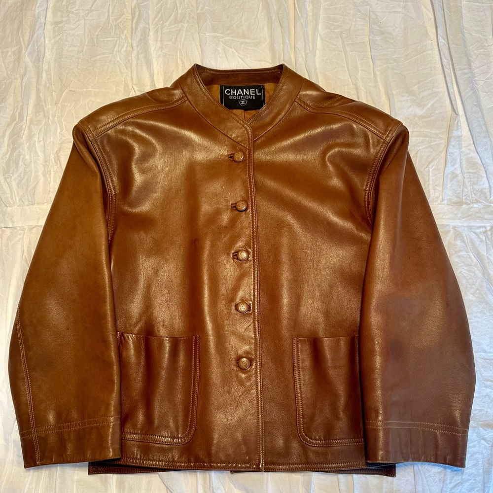 Vintage Chanel Boutique brown lambskin leather jacket with silk liner.